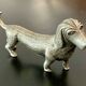 12 old dog-shaped Etains du Manoir knife holders