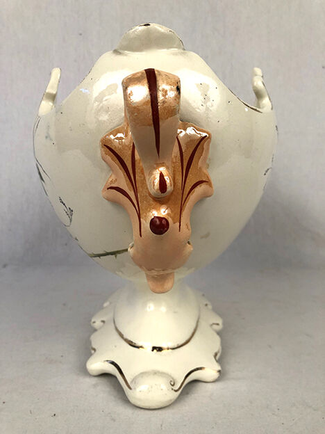 Planter of oblong shape on foot