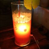 Vintage 80s cocktail lamp in colored glass with a straw and a slice