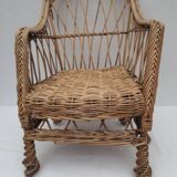 child's or doll's armchair in light woven wicker