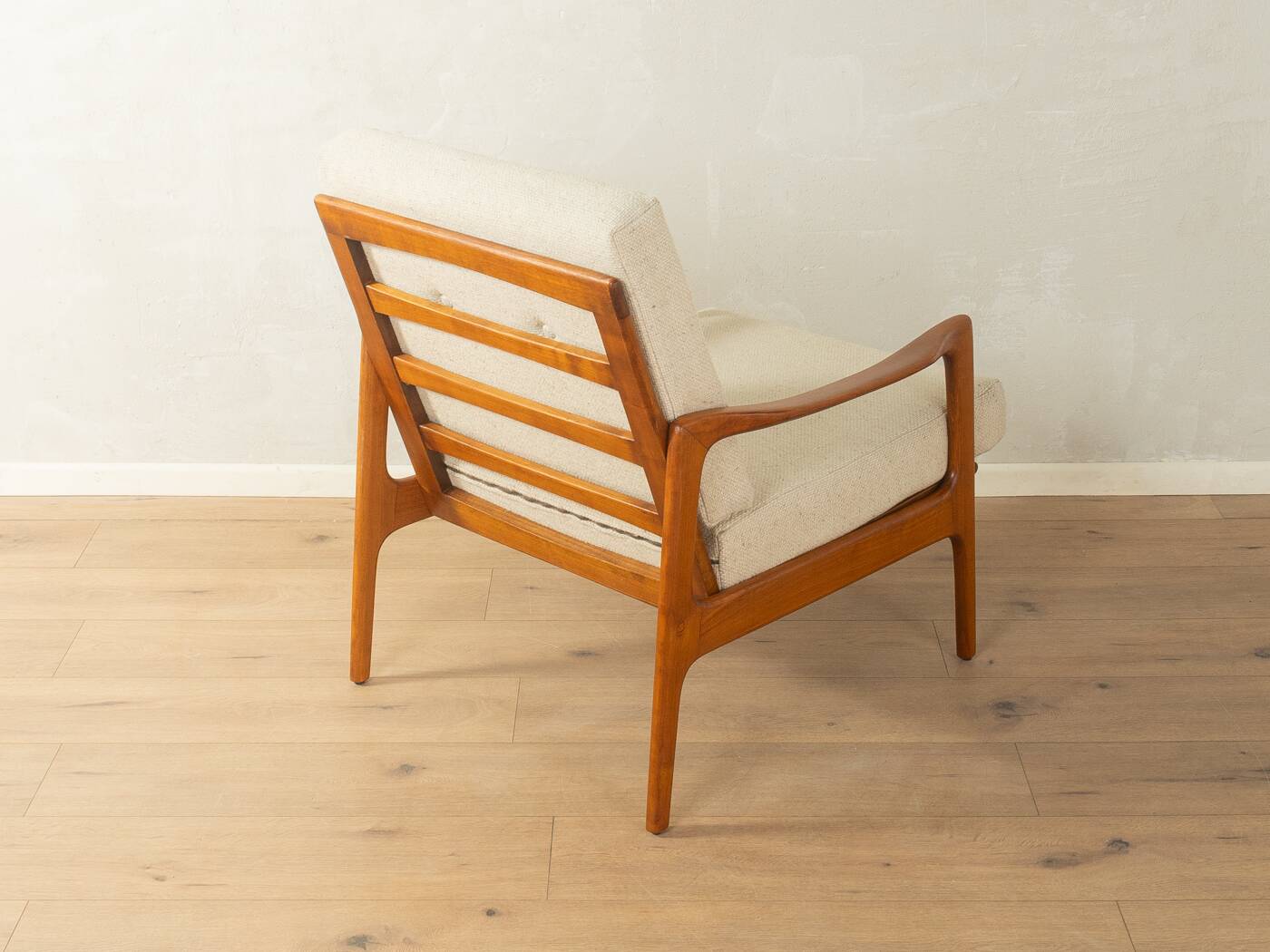 Elegant mid-century armchair from the 1960s with cream-white upholstery