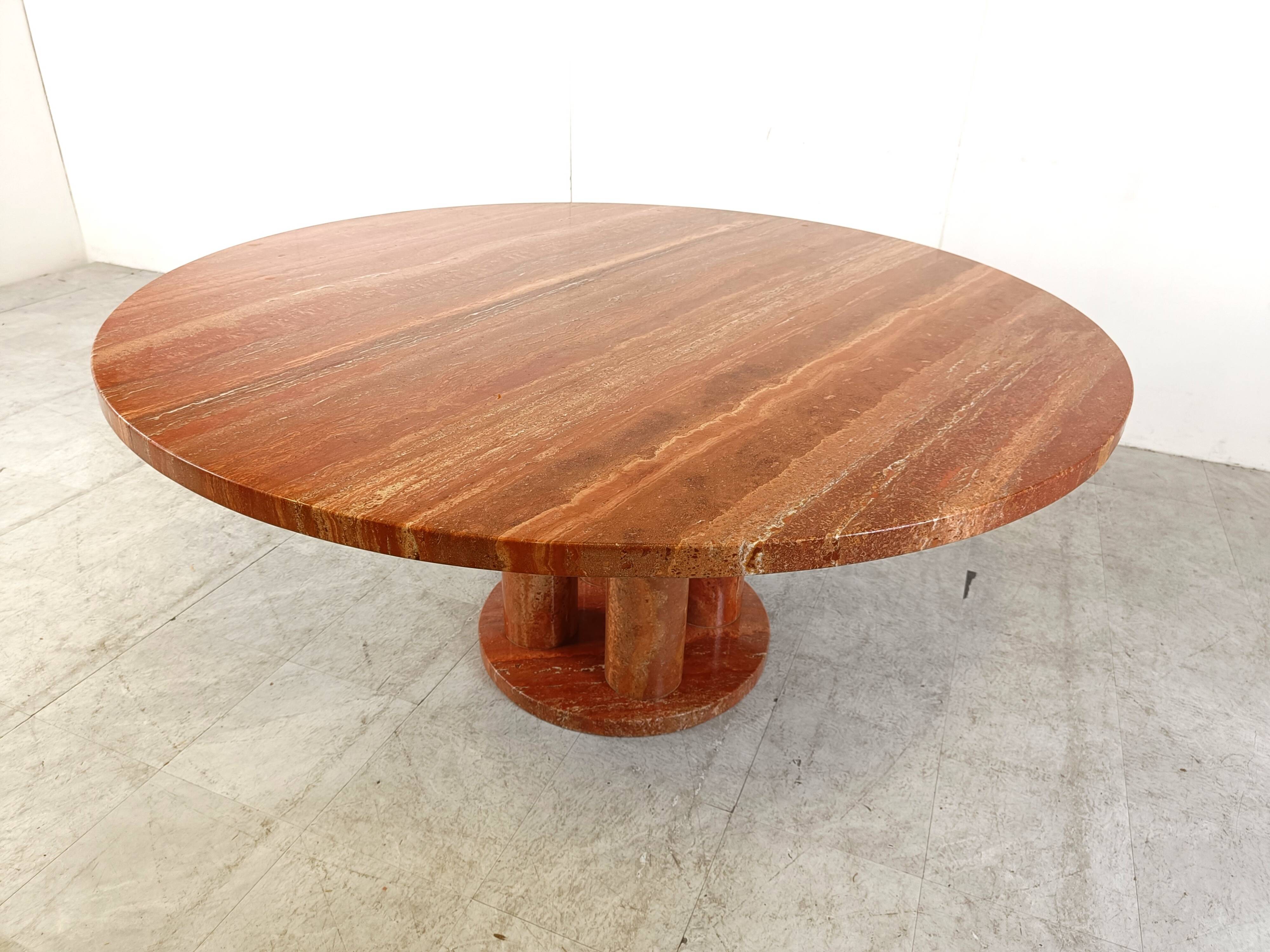 Large round red travertine dining table, 1970s