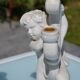 Pair of "cherub" candle holders in plaster