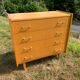 Commode 4 tiroirs vintage en aggloméré plaqué véritable bois