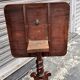 19th-century solid mahogany table with a tilting top and brass mechanism.