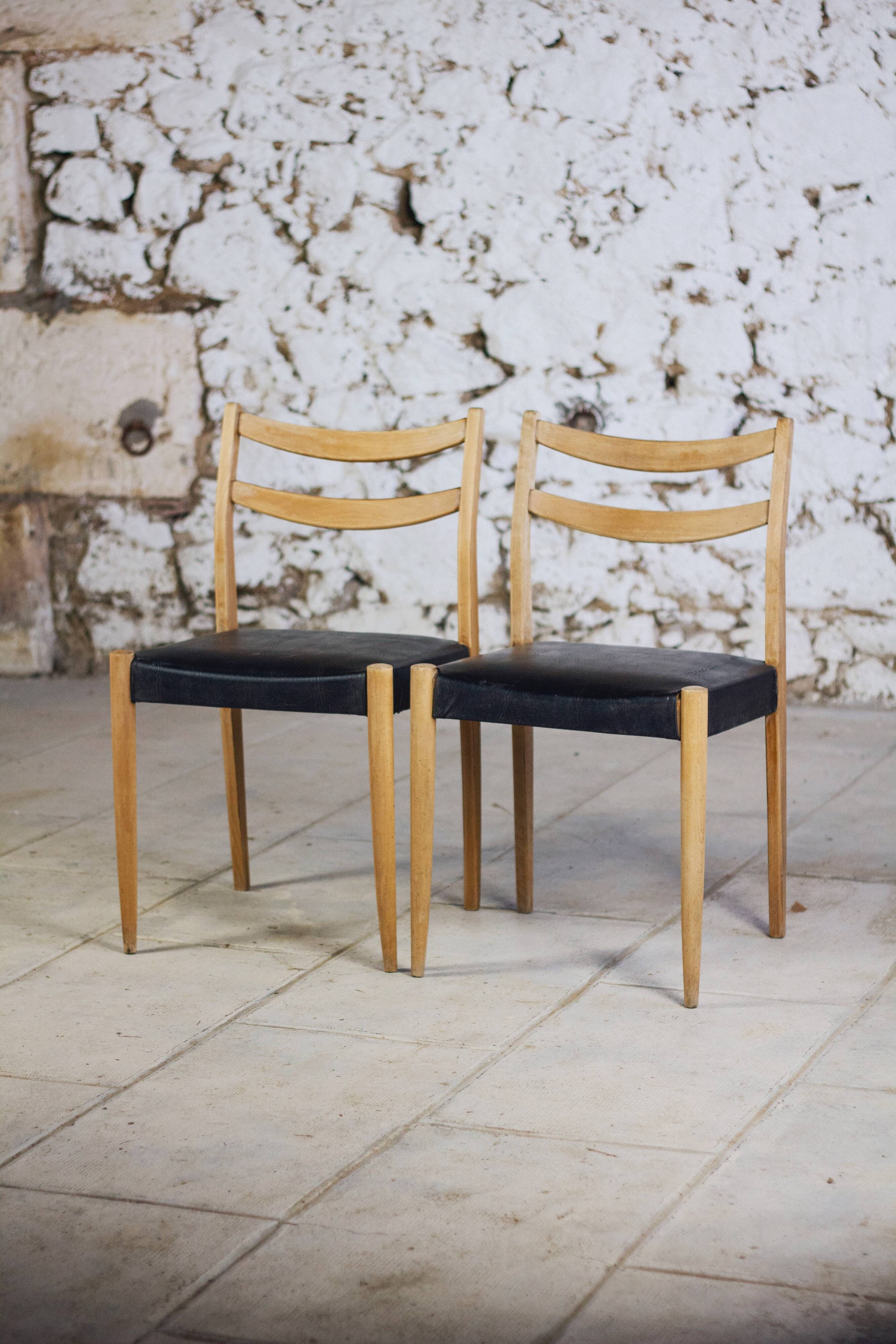 Pair of Scandinavian chairs in teak and faux leather, 1960.