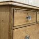 English chest of drawers in nineteenth century fir with its glass buttons