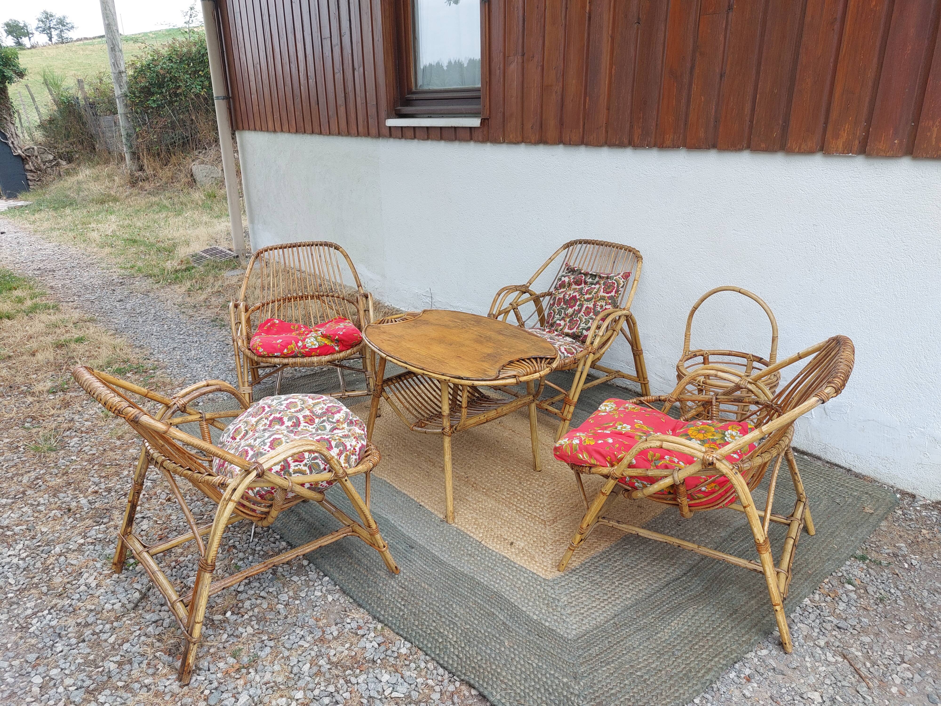 4 armchairs and a coffee table made of rattan and bamboo wood, vintage.