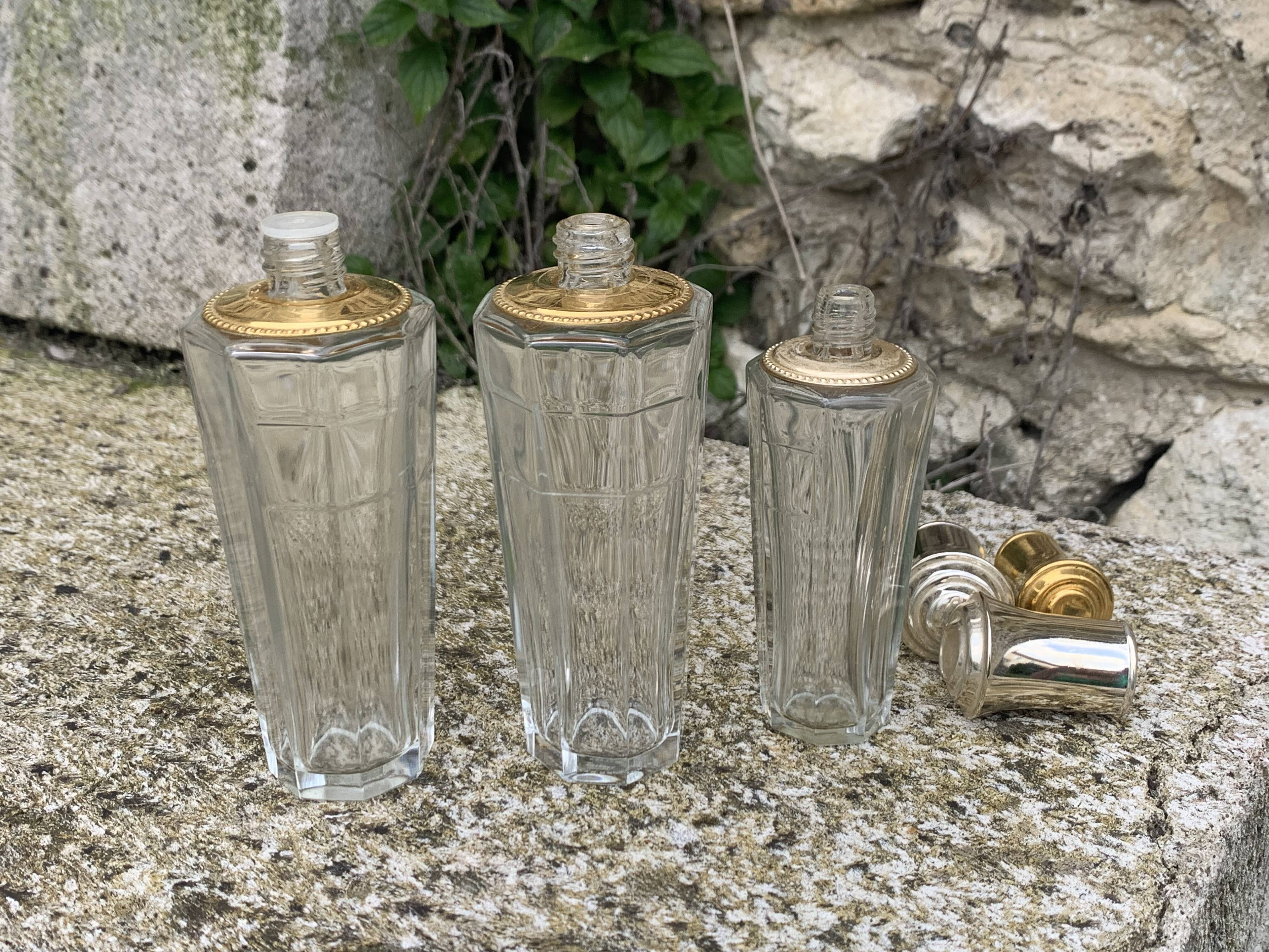 Three bottles of crystal perfume signed Marcel Rochas old france