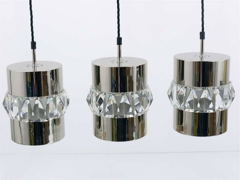 Three Bakalowits pendant lamps in nickel, brass, and faceted crystal, Austria, 1950s.