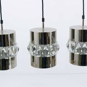 Three Bakalowits pendant lamps in nickel, brass, and faceted crystal, Austria, 1950s.