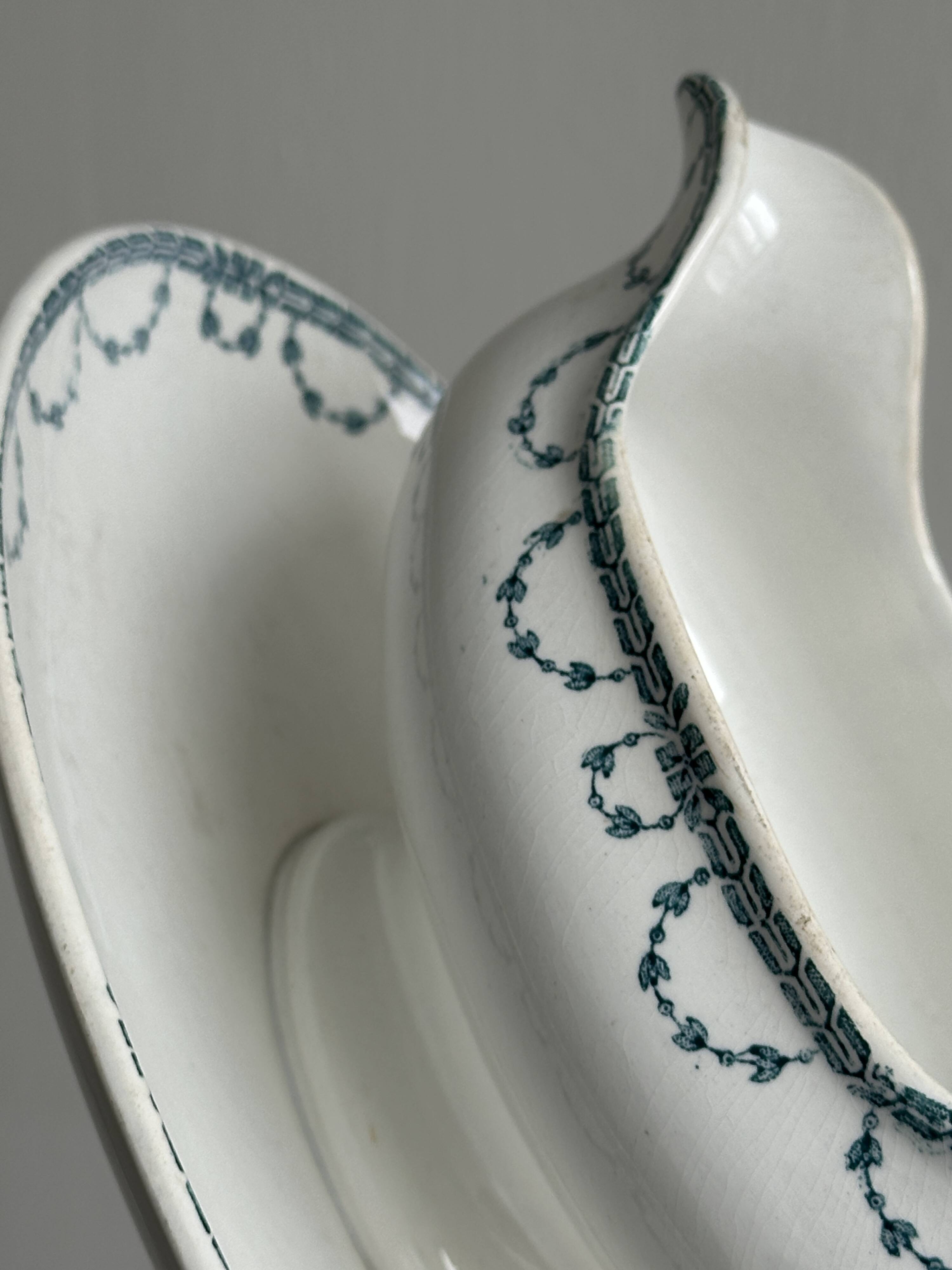 Antique porcelain sauceboat with tray