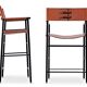 Pair of bar stools with backrest, tobacco colour and black metal.