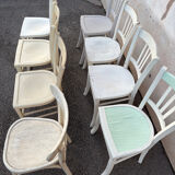 Set of 8 mismatched white bistro chairs