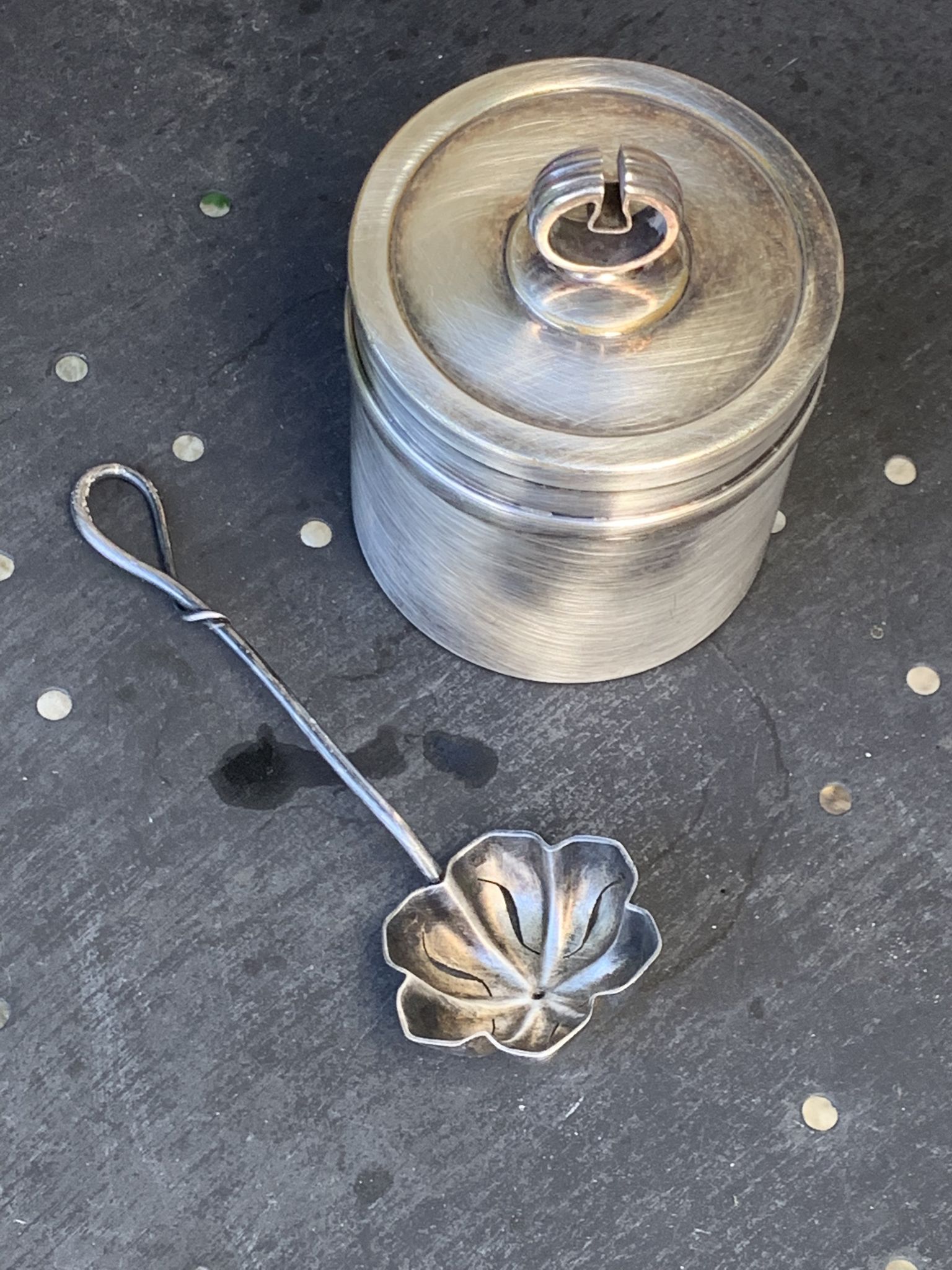 Sprinkling spoon and art deco sugar pot in silver metal