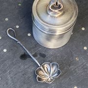 Sprinkling spoon and art deco sugar pot in silver metal