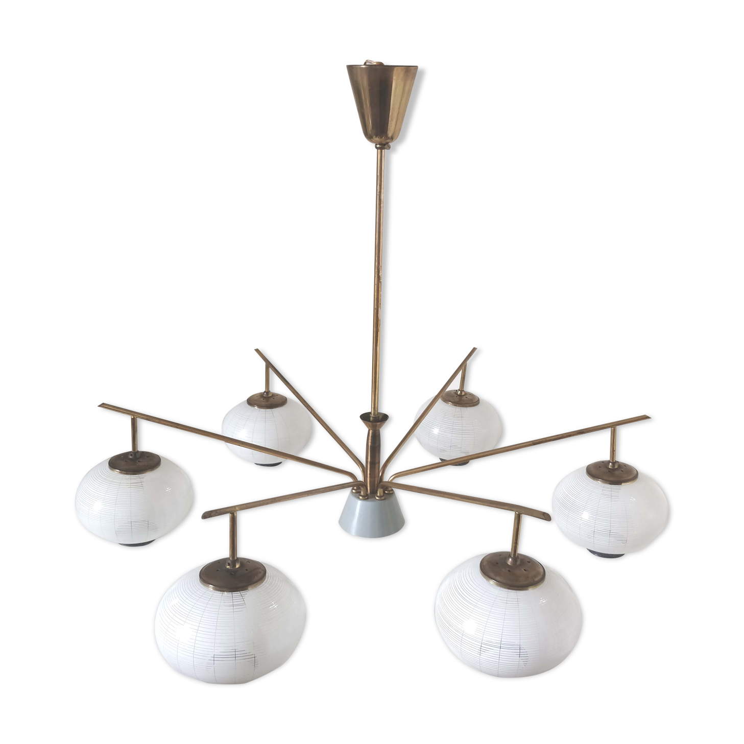 Brass chandelier and 6 white streaked glass globe lights
