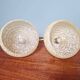 Pair of brass and yellow/white speckled glass wall sconces