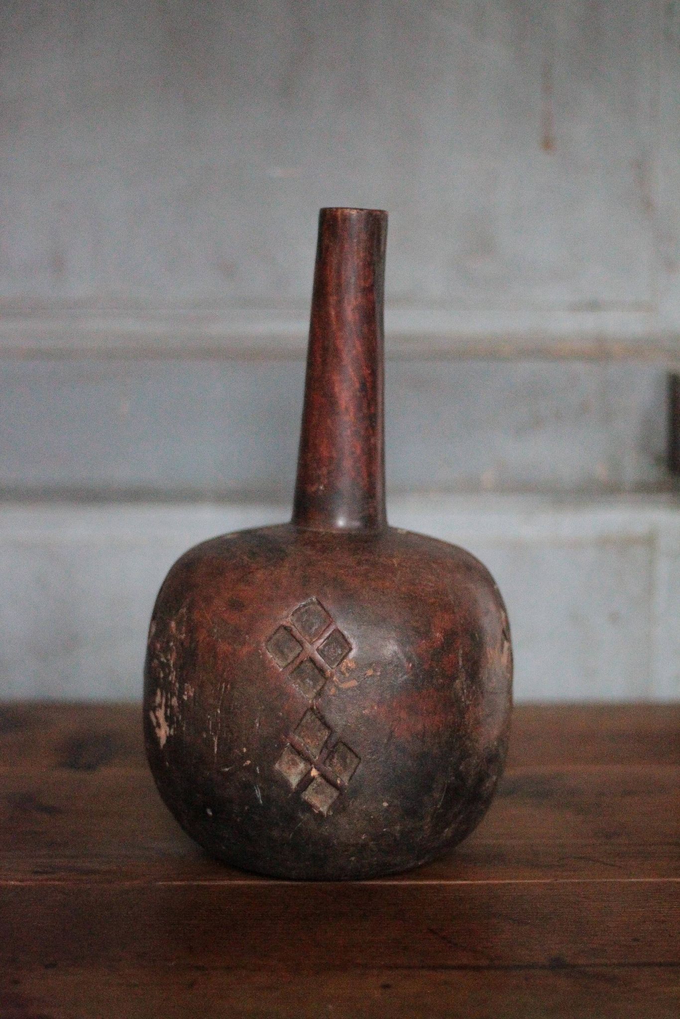 Vintage African wooden carved gourd bottle.