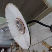 industrial wall light in the shape of a swan neck