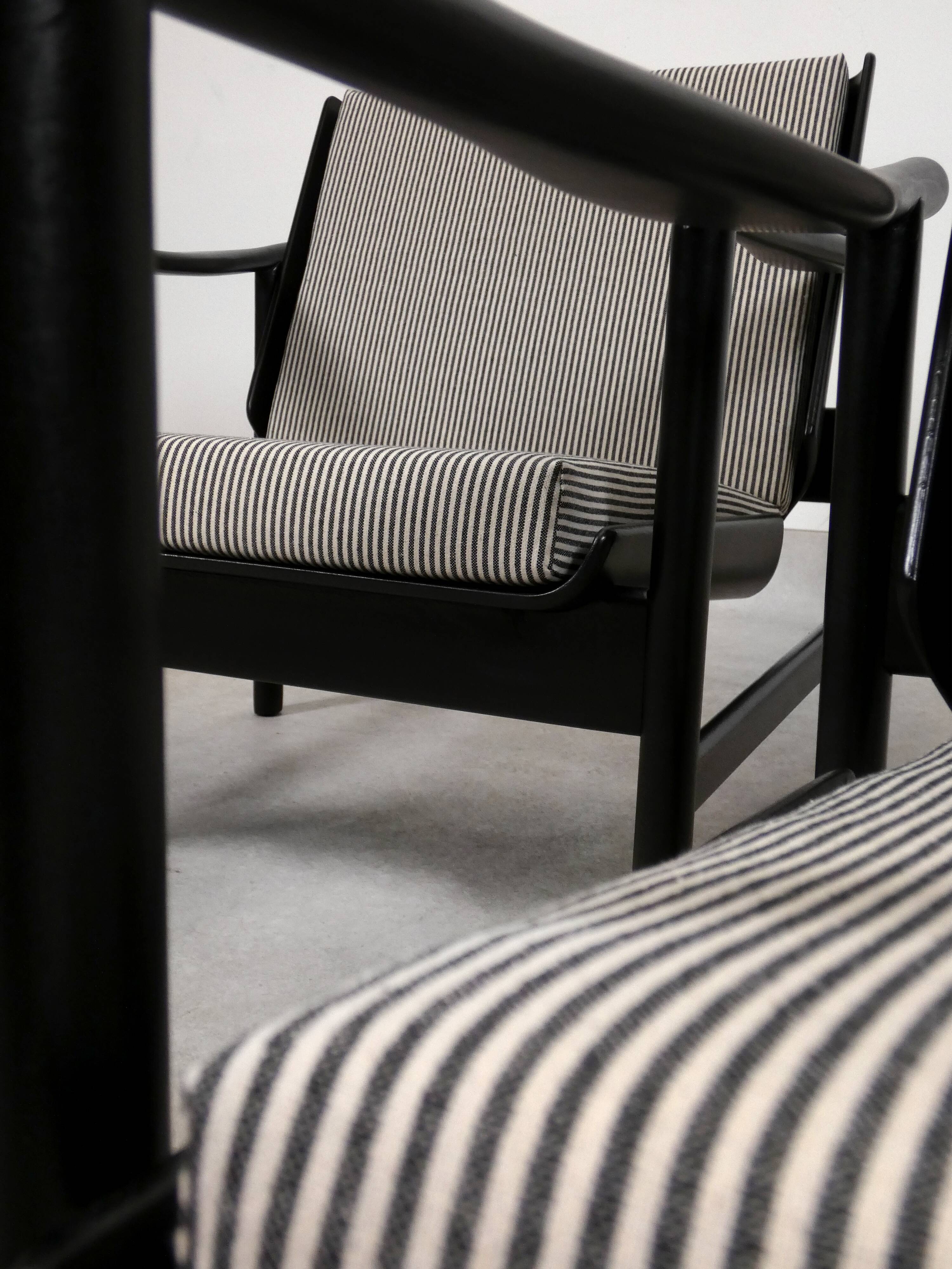 2x wooden Scandinavian arm chairs