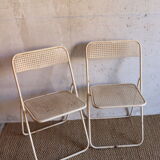 Two metal tanned folding chairs