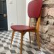 Chaise skaï rouge années 60