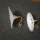 Wall sconces with scalloped opaline lampshades.