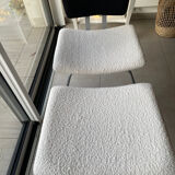 Armchair and footrest in boucle wool.