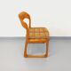 Vintage sled chair by Baumann in wood and wool fabric.