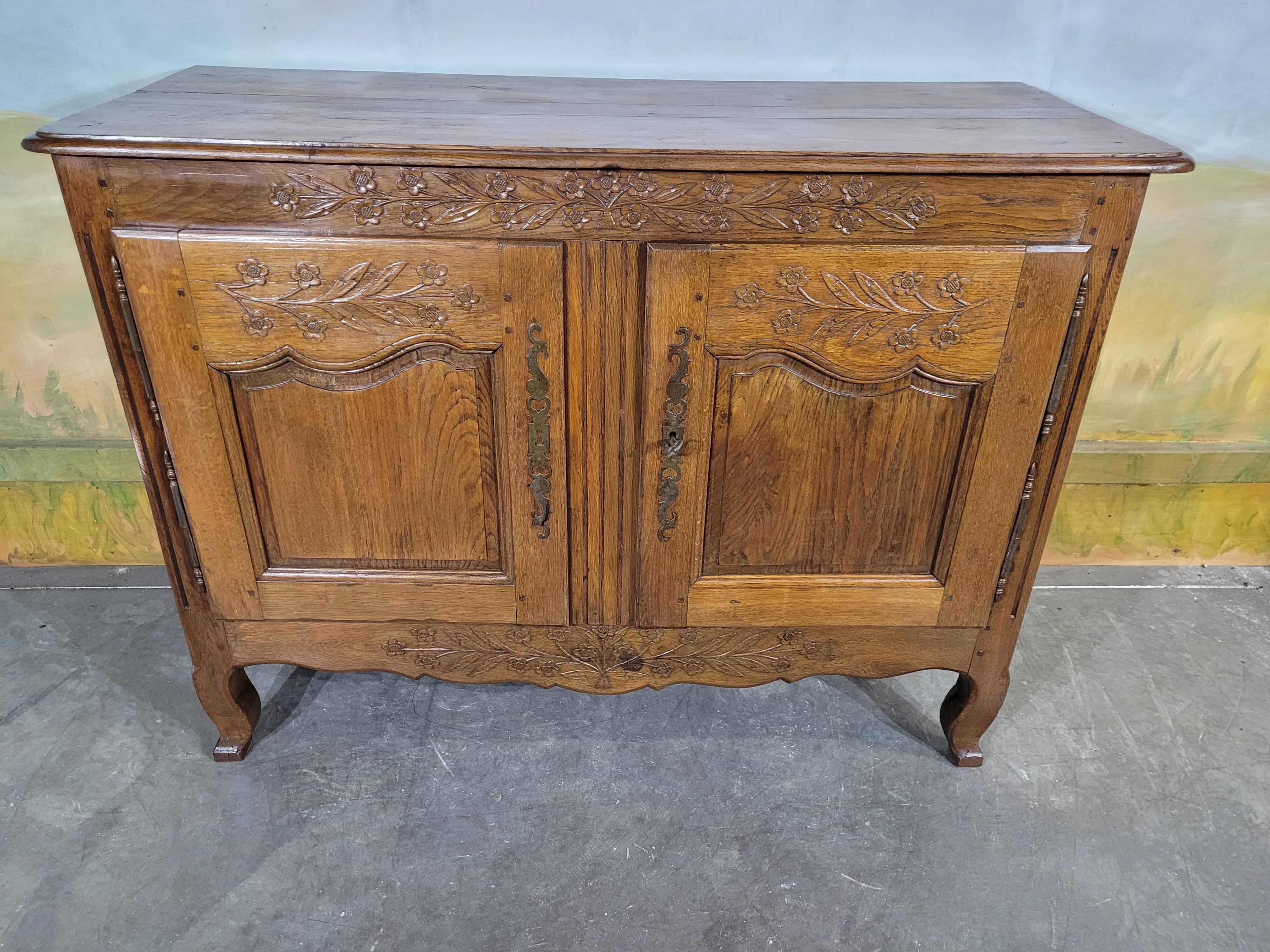 Low Norman sideboard carved in 19th century oak