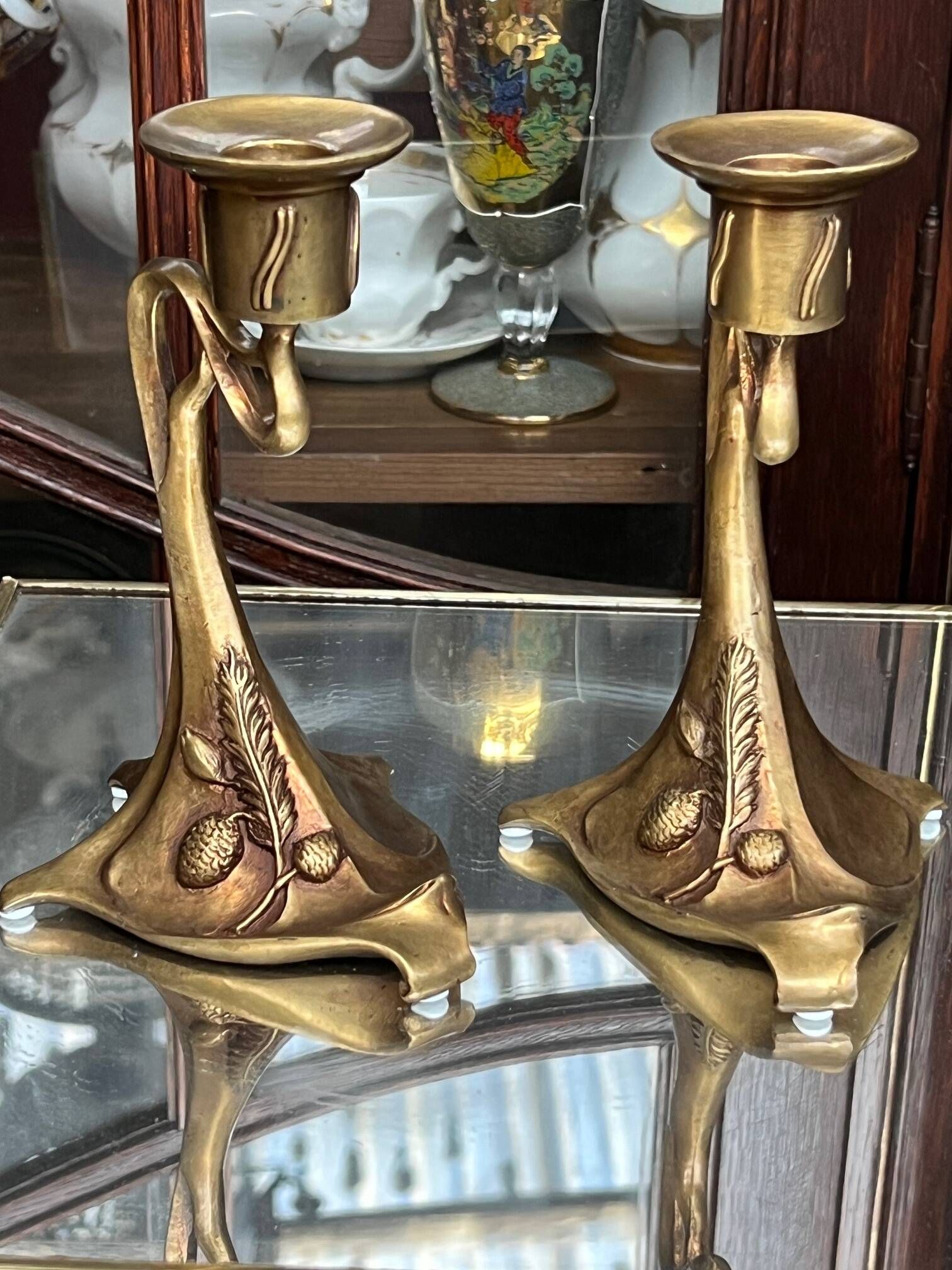 Pair of Art Nouveau style candlesticks. Solid bronze.