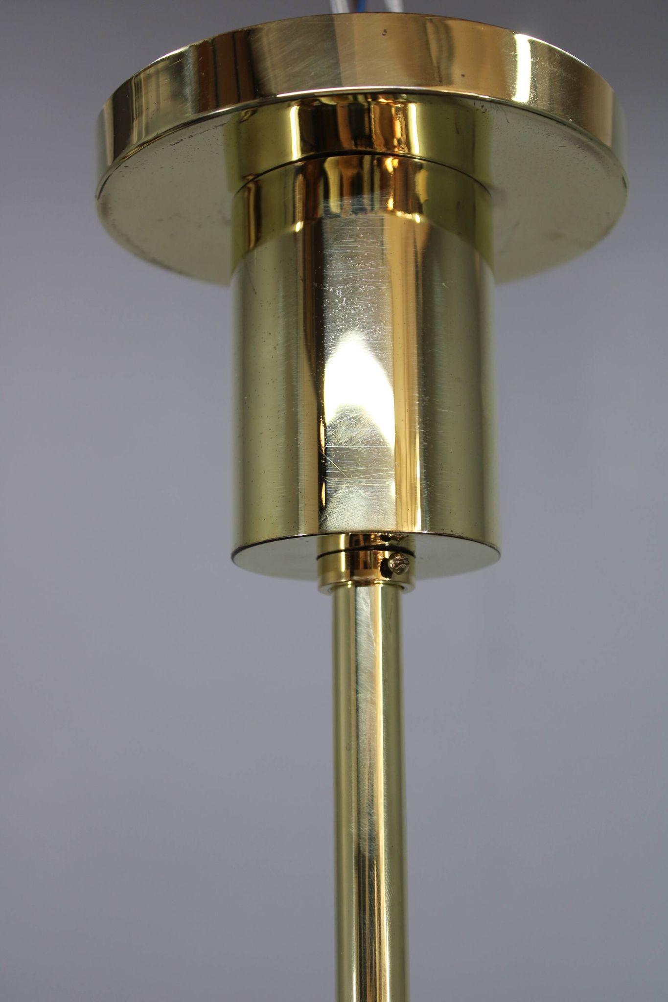 1930s Czech Art Deco brass chandelier with milk glass center and exposed bulbs