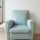 Vintage armchair in light blue faux leather retro style