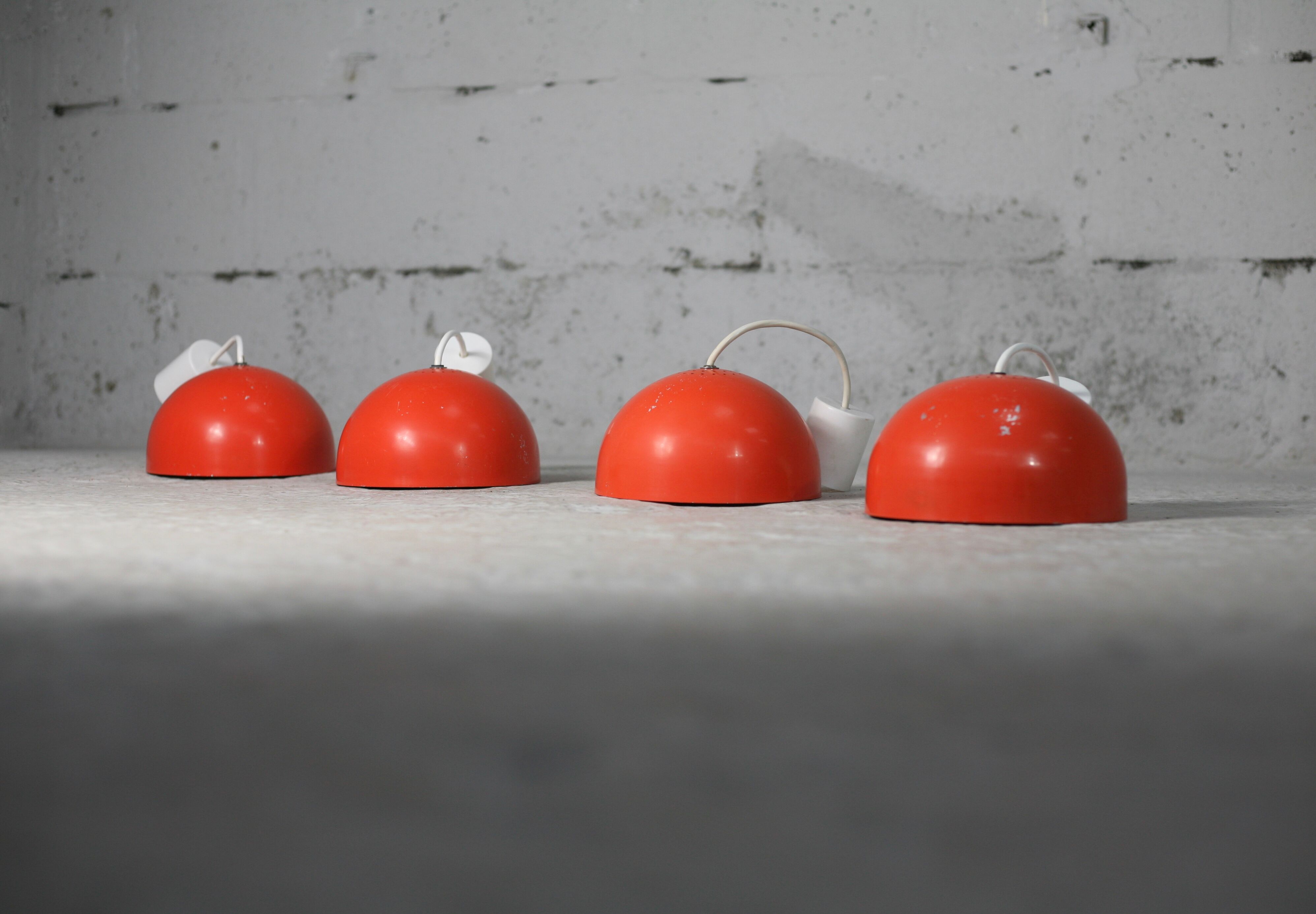 Set of 4 "spring" hanging lamps, orange steel, France, circa 1970