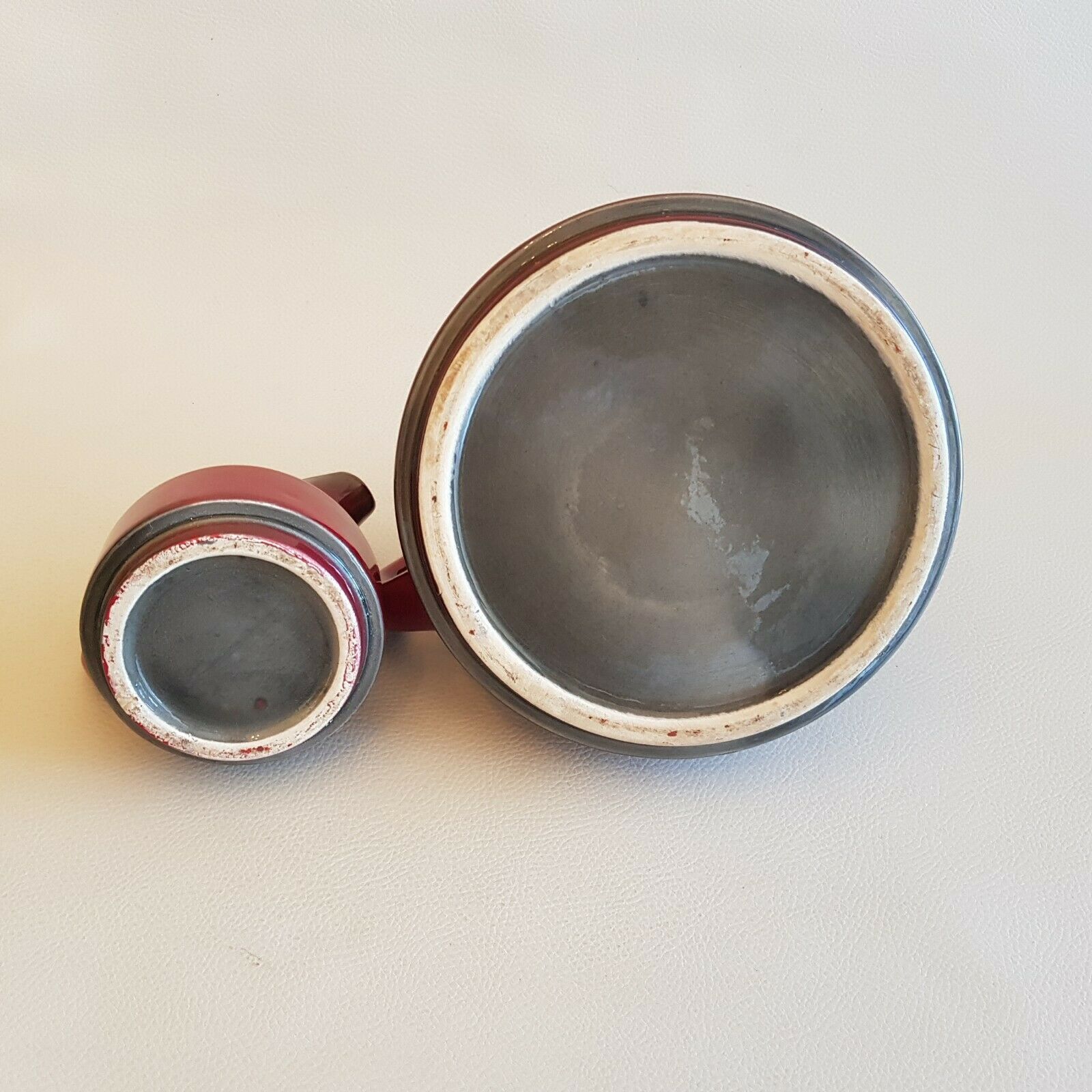 Teapot and milk jar in burgundy red ceramic