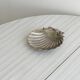shell-shaped metal pocket tray with patina
