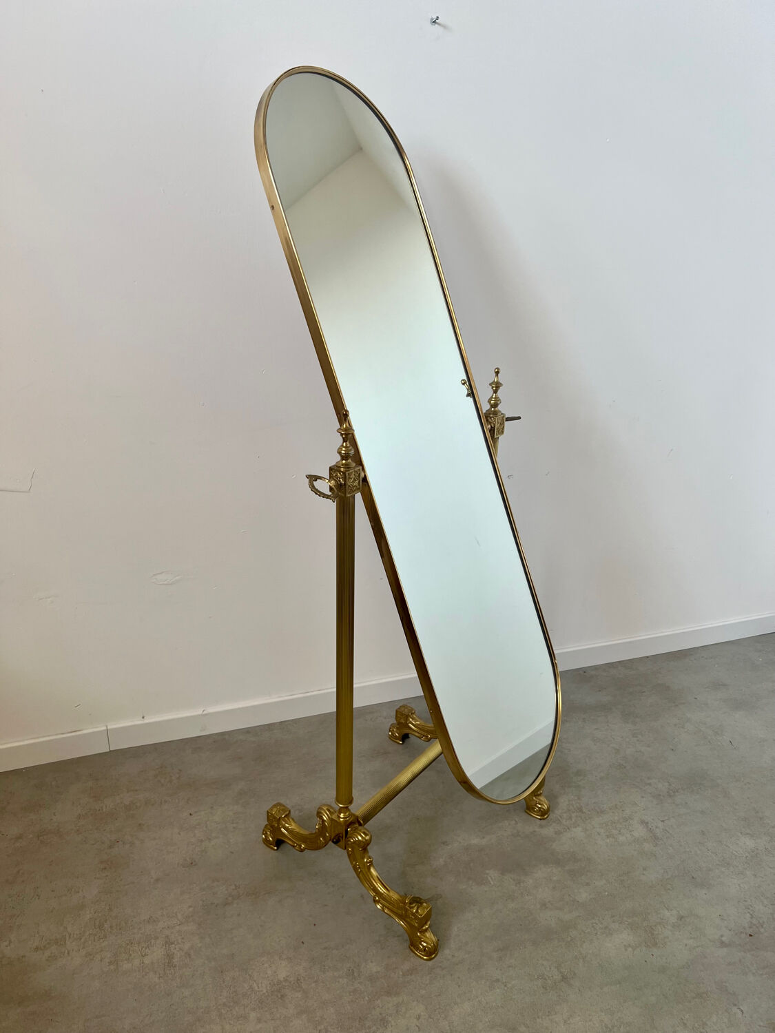 Old free-standing mirror in gilded brass in psychedelic neoclassical style Years 40 France