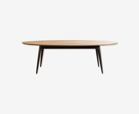 Oval dining table in solid walnut on solid beech base painted black