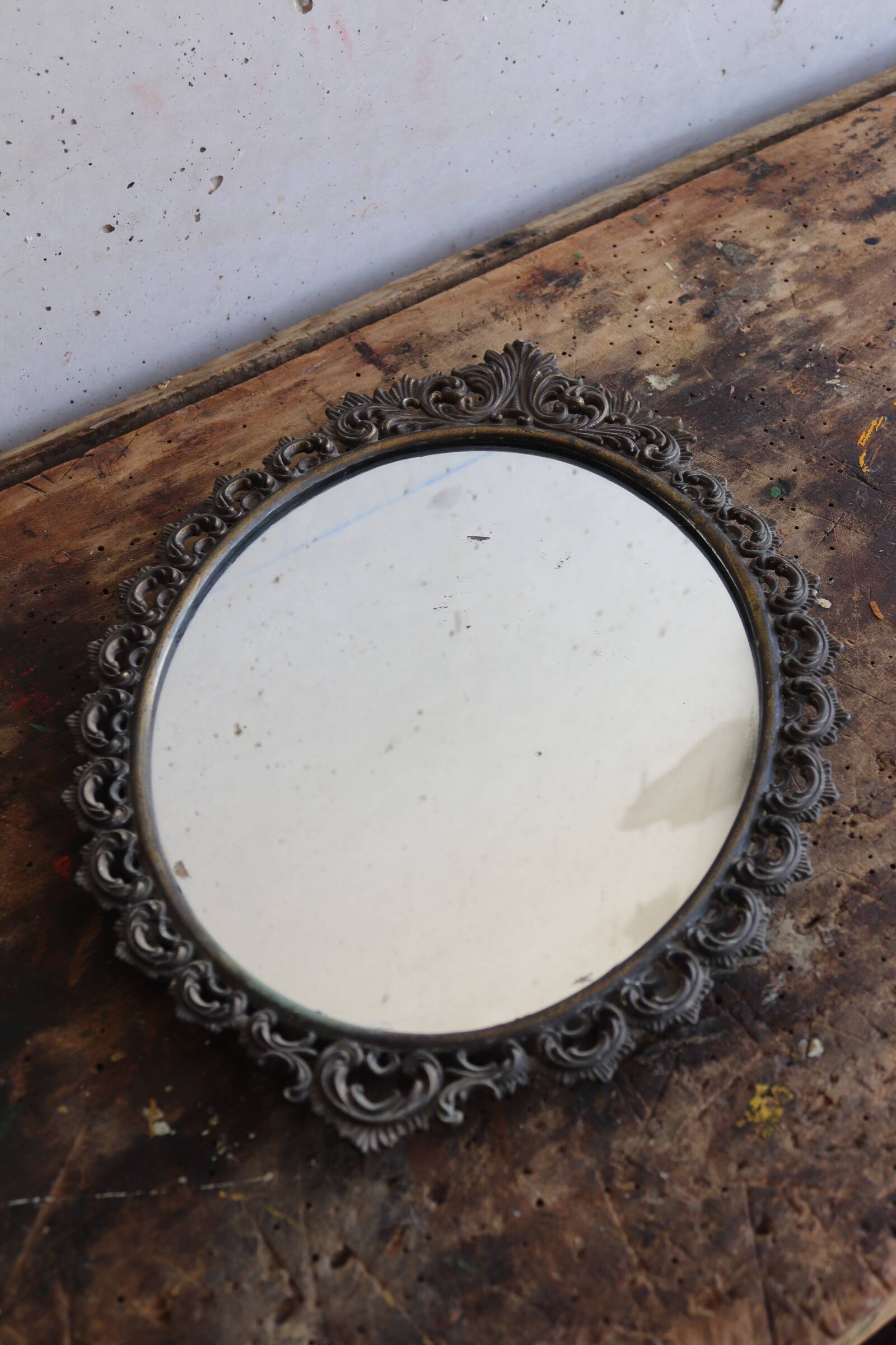 Baroque style oval metal mirror