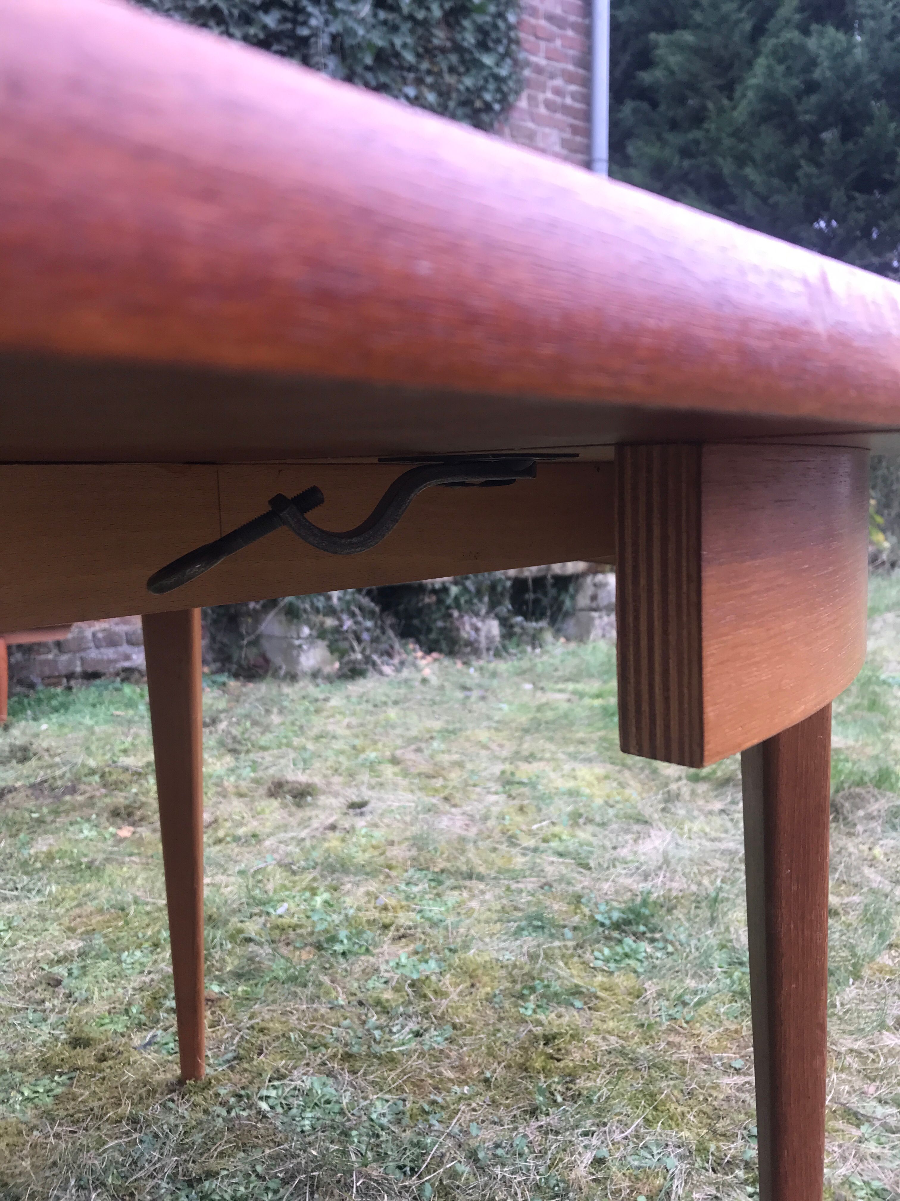 Extendable round vintage dining table