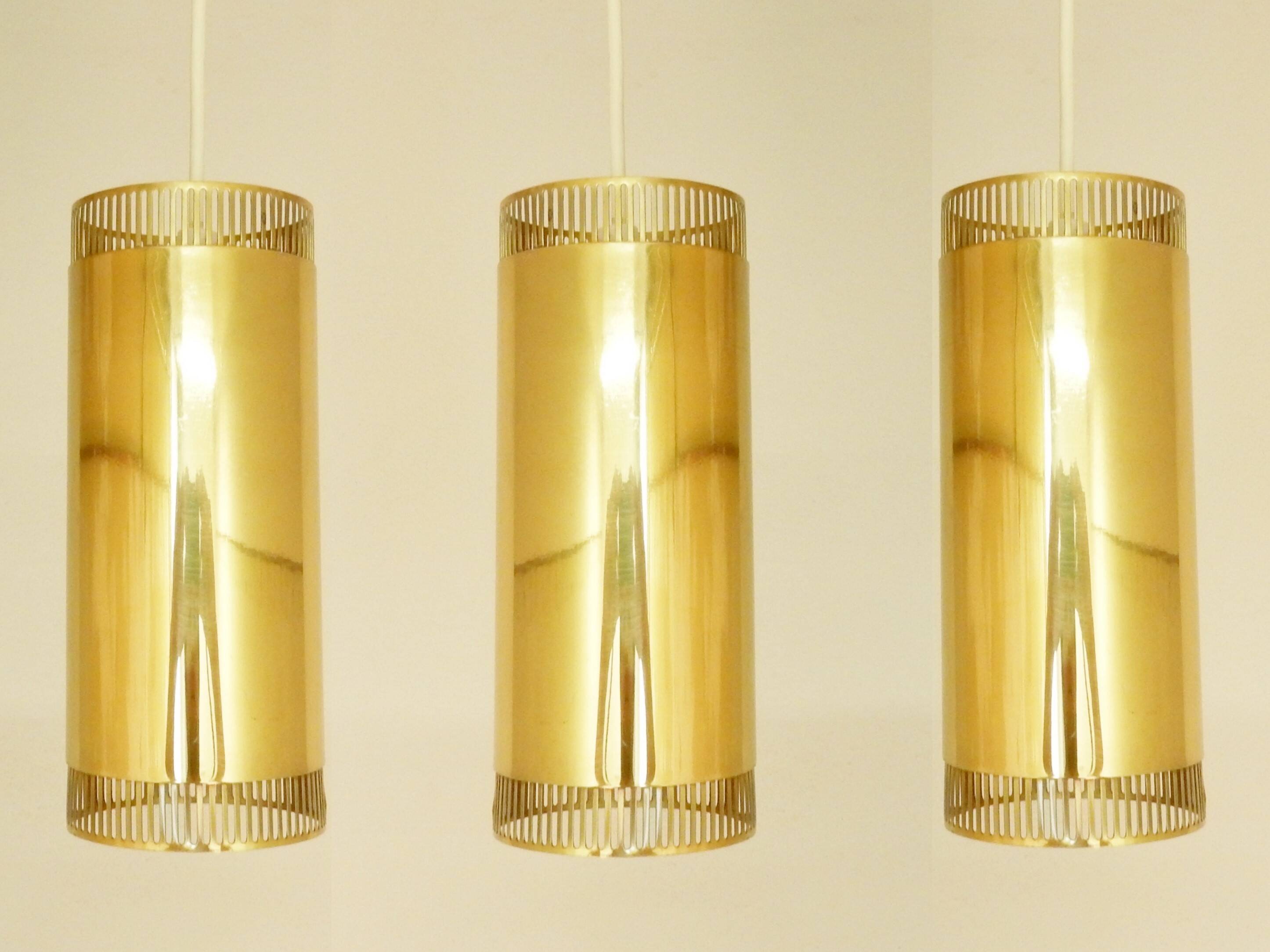 Set of 3 perforated brass cylindrical pendant lamps, Sweden 1960's