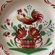 St Clement France plate, floral basket and rooster decoration