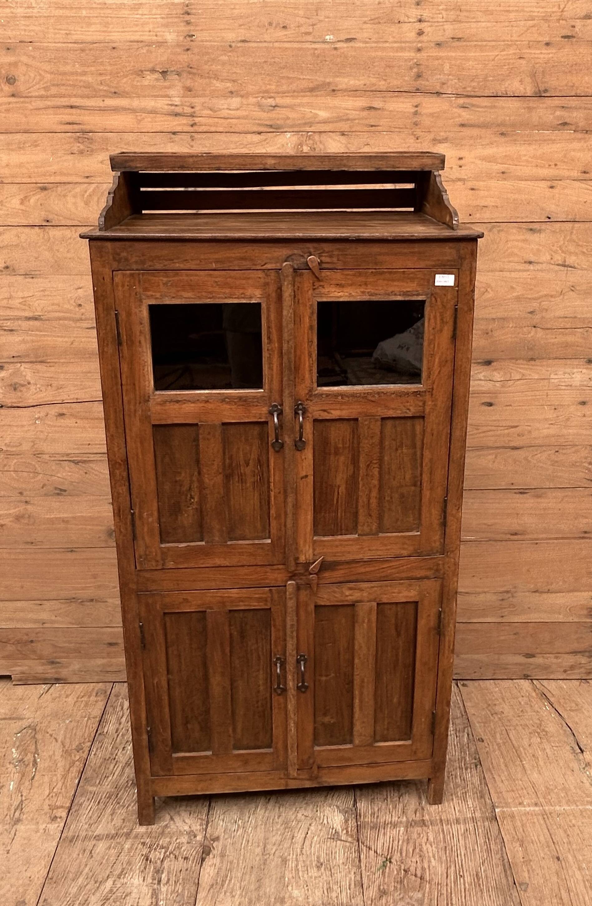 Art Deco glass-fronted cabinet in Burmese teak with original patina.