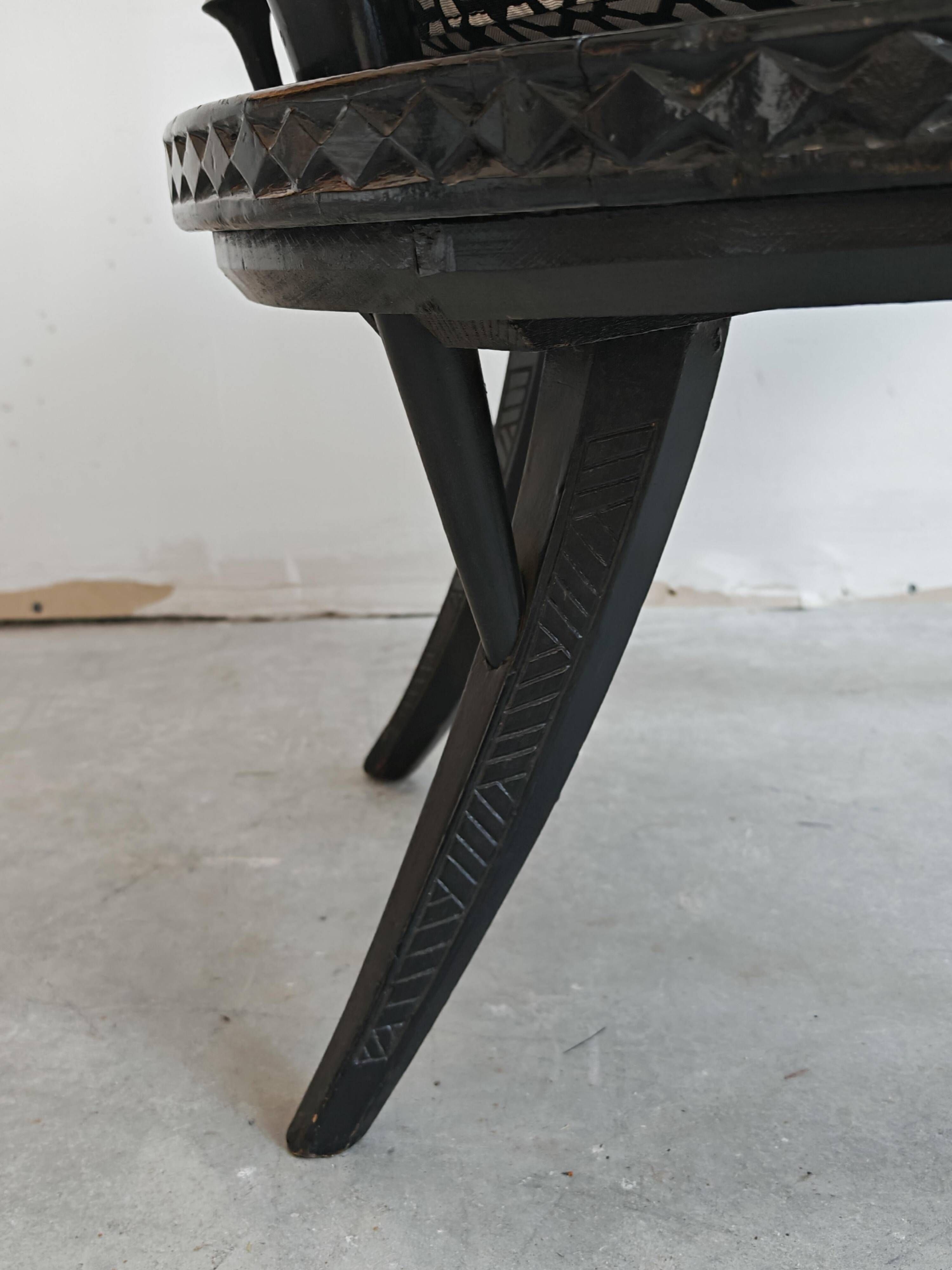 Pair of antique hand-carved armchairs in black lacquer from the 1920s.