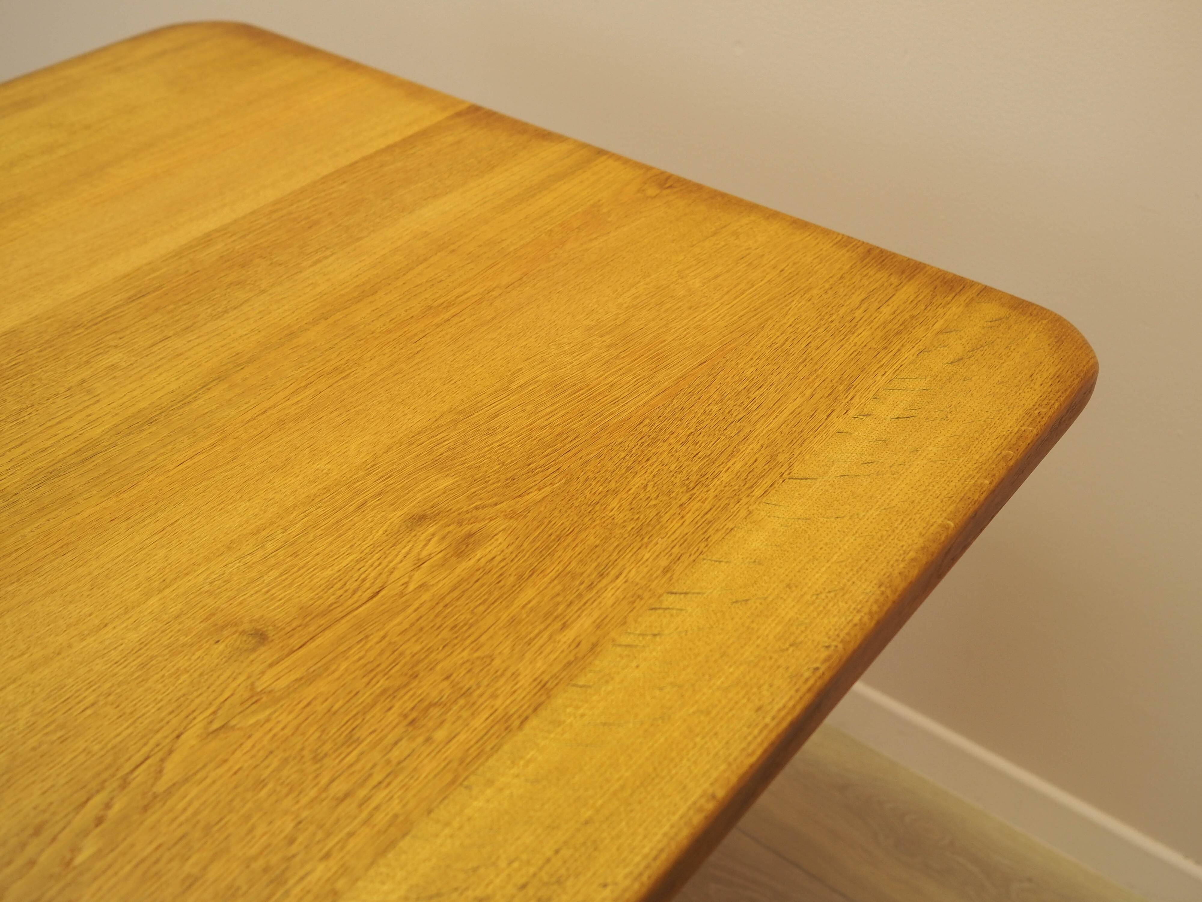 Solid oak dining table by Henning Kjærnulf, Denmark, 1960s