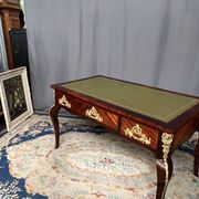 Louis XV style desk. Rosewood veneer, gilt bronze decoration, leather.