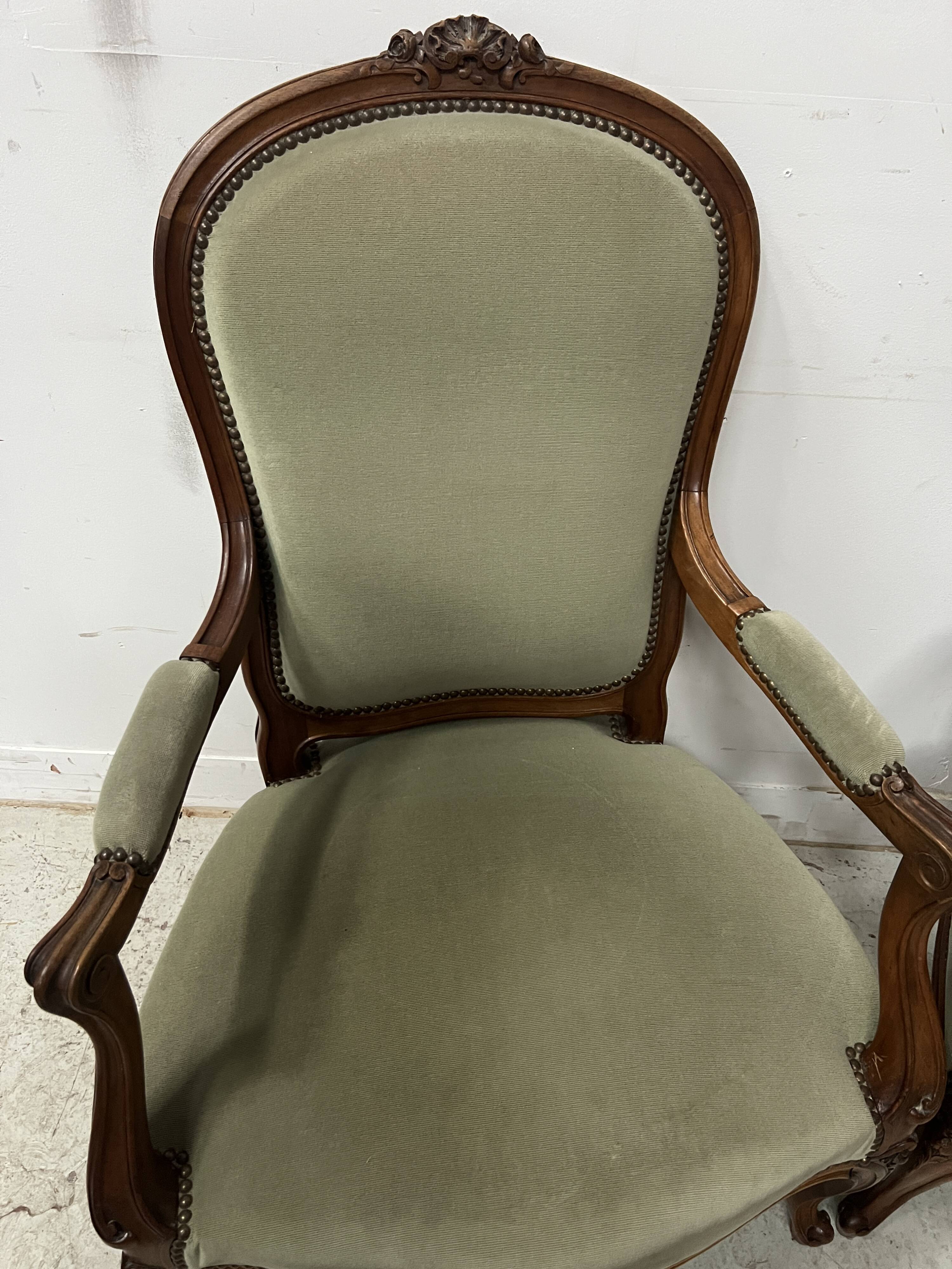 Pair of Louis XV style armchairs in solid walnut, 20th century.