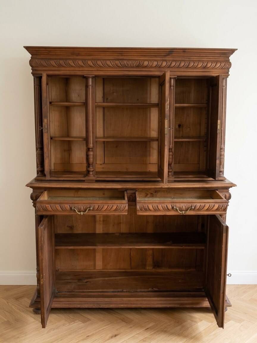 Large antique wooden sideboard carved in rustic style.