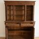 Large antique wooden sideboard carved in rustic style.